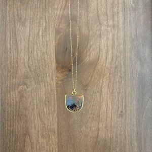 Elegant gold necklace made with real wildflowers.